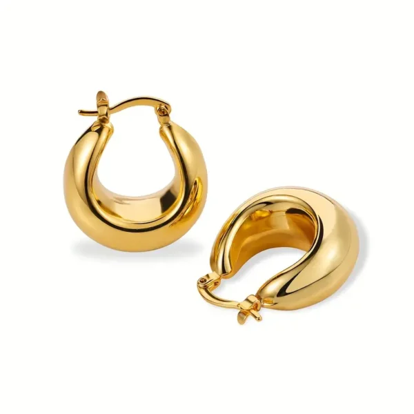 The Elegant French Retro 14K Gold Plated Chunky Hoop Earrings – Minimalist Vintage Style are displayed on a white background, showcasing their sleek, thick design. Each earring features a polished, shiny surface and a latch back closure. The simple yet elegant style exudes a modern aesthetic while the chunky hoops add a touch of boldness.