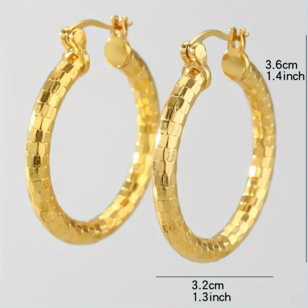 The 14K Gold Plated Delicate Hoop Earrings - Vintage Bohemian Style are showcased against a plain background, highlighting their dimensions with a diameter of 3.6 cm (1.4 inches) and width of 3.2 cm (1.3 inches). The textured hoops are equipped with a hinged clasp mechanism for secure wear.