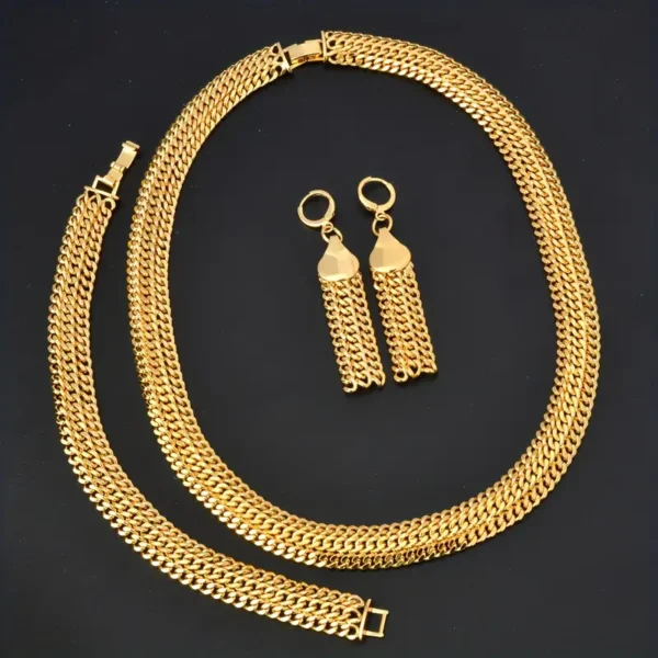 The Hip Hop Miami Cuban Necklace and Bangle Earrings Set is displayed against a black background. This stunning jewelry set includes a Miami Cuban necklace, a bracelet, and a pair of dangling earrings, each featuring an intricately interwoven chain design perfect for unisex fashion jewelry enthusiasts.