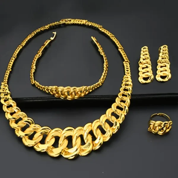 A set of jewelry from the "Chunky Gold Necklace Jewelry Set: Bridal, Wedding, & Party Glam" collection is displayed against a black background. This bold, gold-toned set features a chunky gold necklace, matching bracelet, dangle earrings, and a ring, all showcasing a uniform chunky chain link design.