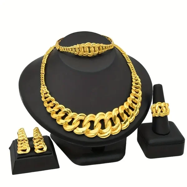 The Chunky Gold Necklace Jewelry Set: Bridal, Wedding, & Party Glam includes a display of large gold jewelry on black stands. The set features a chunky gold necklace with a matching bracelet, a wide ring, and a pair of drop earrings that all showcase the same chain design.