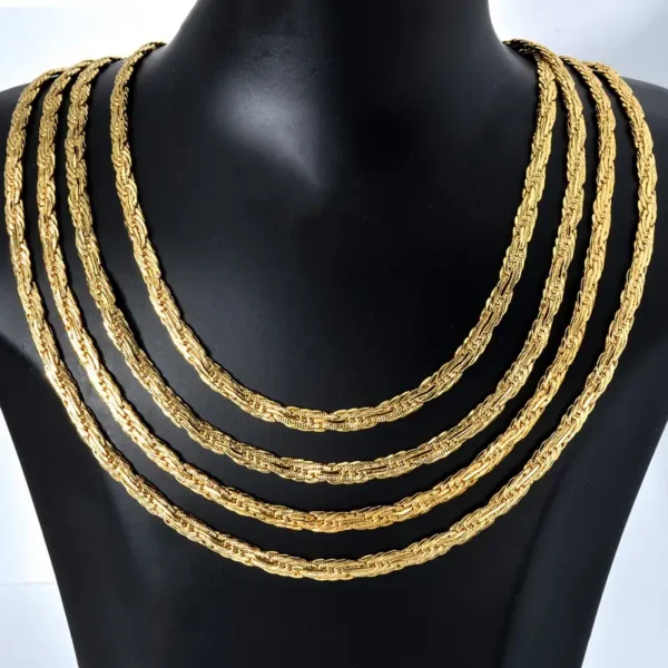 A display bust showcasing the Golden Chain 0.2inch Wide Long Geometric Necklace. The four layered gold rope chains are arranged in descending order of length, draping elegantly from the top down to its chest. The intricate braided design of each chain is prominently highlighted against the matte black surface.