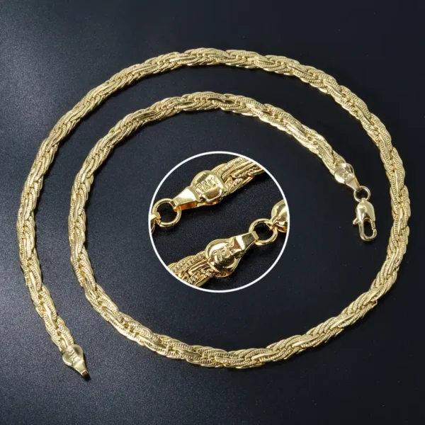 A dainty Golden Chain 0.2-inch Wide Long Geometric Necklace lies coiled on a black surface. The chain features intricate, woven links, and a zoomed-in circular inset displays the detailed clasp mechanism of this geometric gold necklace.