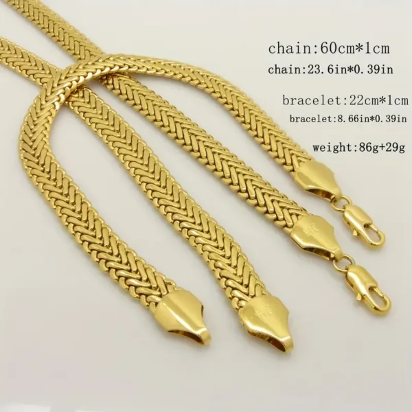 Introducing the Hip Hop Royalty: Gold Plated Herringbone Set, a stunning collection of hip hop jewelry featuring two chains and a bracelet with an intricate herringbone pattern. The set includes a 60 cm chain and a 22 cm chain, both 1 cm wide and totaling 86 grams in weight. Each piece is secured with a snakehead clasp.