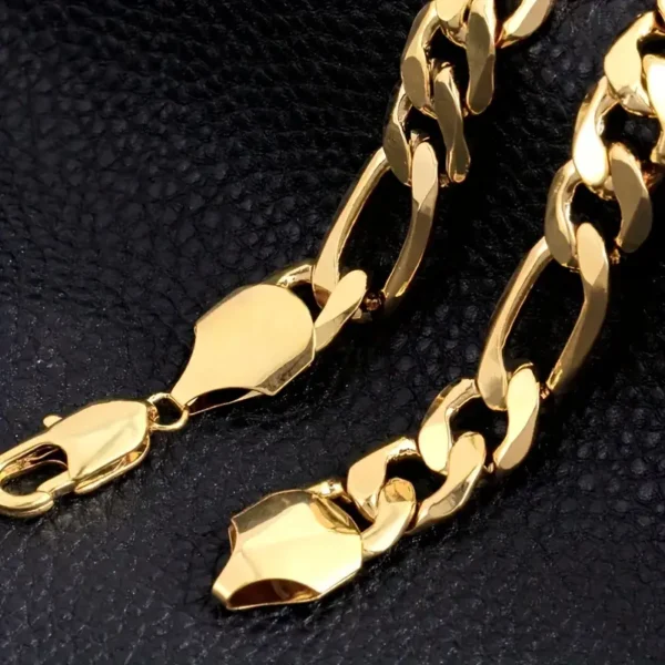 A close-up view of the Golden Statement: Men's Chain Necklace, featuring large, flat links, is displayed against a textured black background. The highly polished gold clasp is visible at the end of the men's chain necklace.