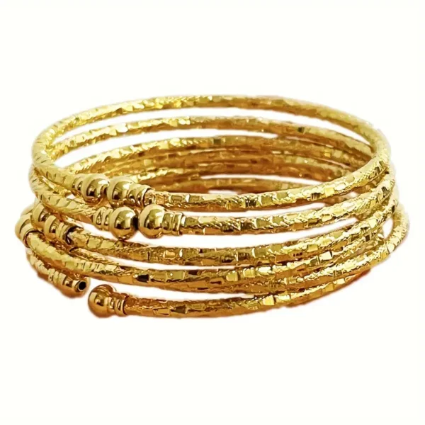 a stack of gold bracelets