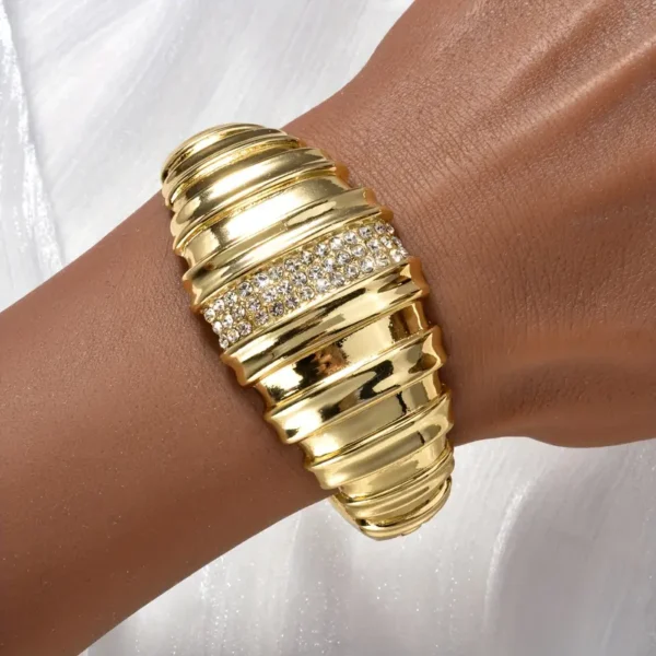 a gold bracelet on a wrist